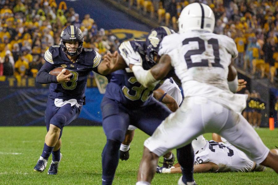 Junior quarterback Kenny Pickett scrambles during Pitt’s 2018 loss to Penn State.
