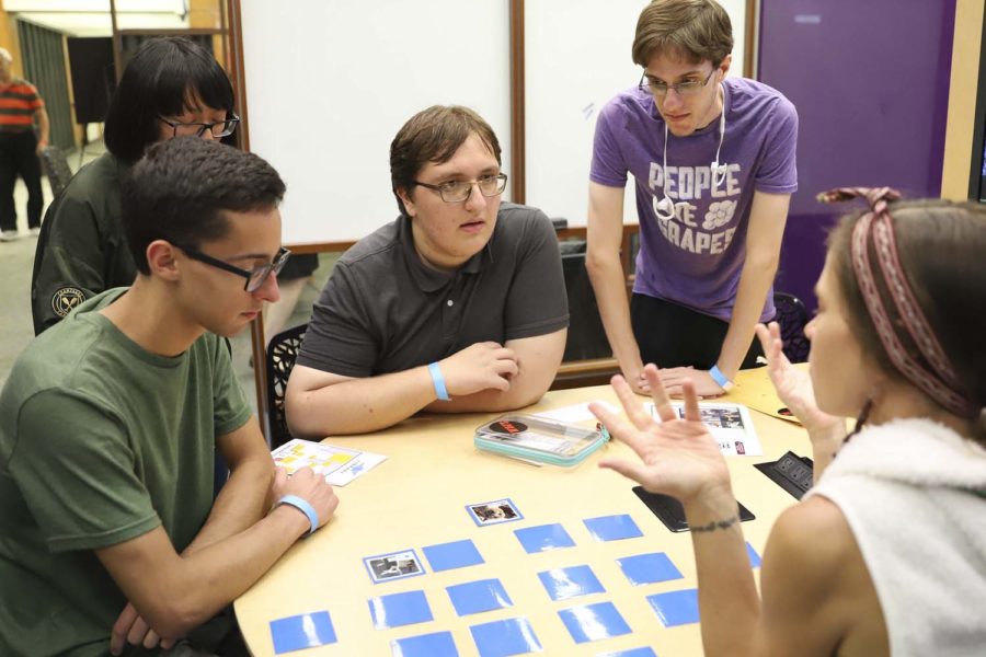 Student’s complete language-based puzzles at the Office of Less Commonly Taught Languages’ “Talk Your Way Out: Escape the Airport!” event in Hillman on Wednesday evening.
