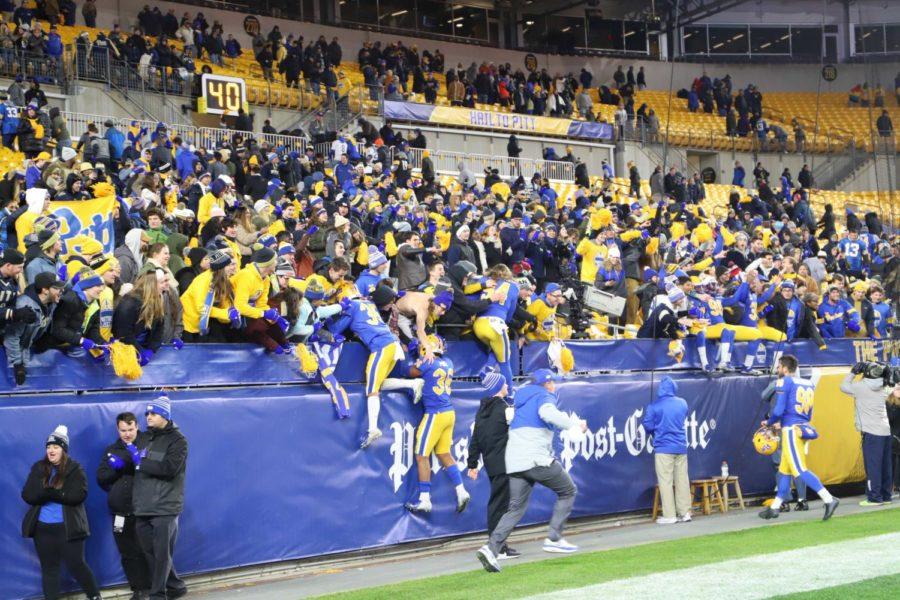 Pitts players celebrate in the student section after beating North Carolina on Thursday night.