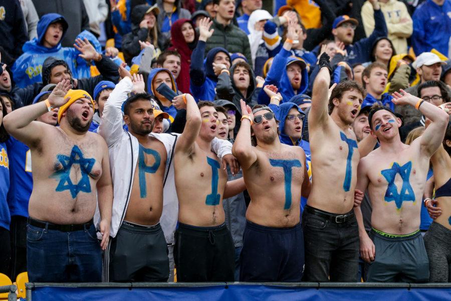 Jonathan Perlman (far left), Pat Gardner (far right) and other students spelled “Pitt Strong” in body paint at an October football game against Miami to honor the Tree of Life victims. 