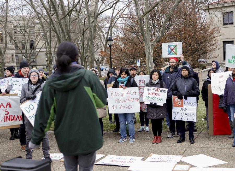 Demonstrators gather around Abhishek Viswanathan, a second-year PhD student studying Information Science, to listen to his speech about the importance of protesting in places like Pittsburgh as well as India against fascism. 