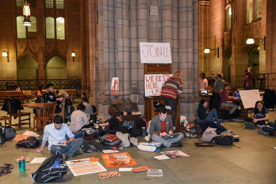 Members and allies of the Fossil Free Pitt Coalition began a 24/7 sit-in in the Cathedral of Learning on Feb. 21.  Joy Cao | Staff Photographer 
