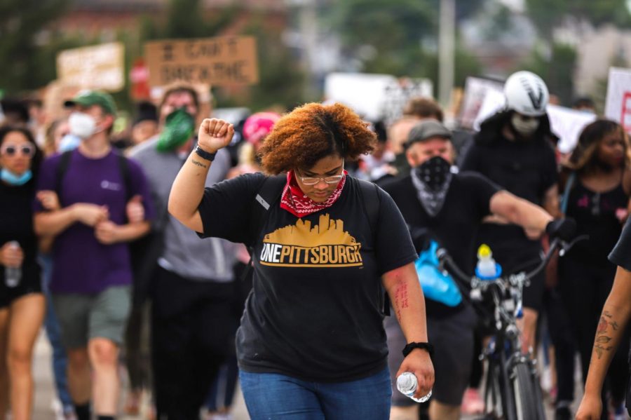 Protesters march across the Birmingham Bridge during a protest on June 4. 