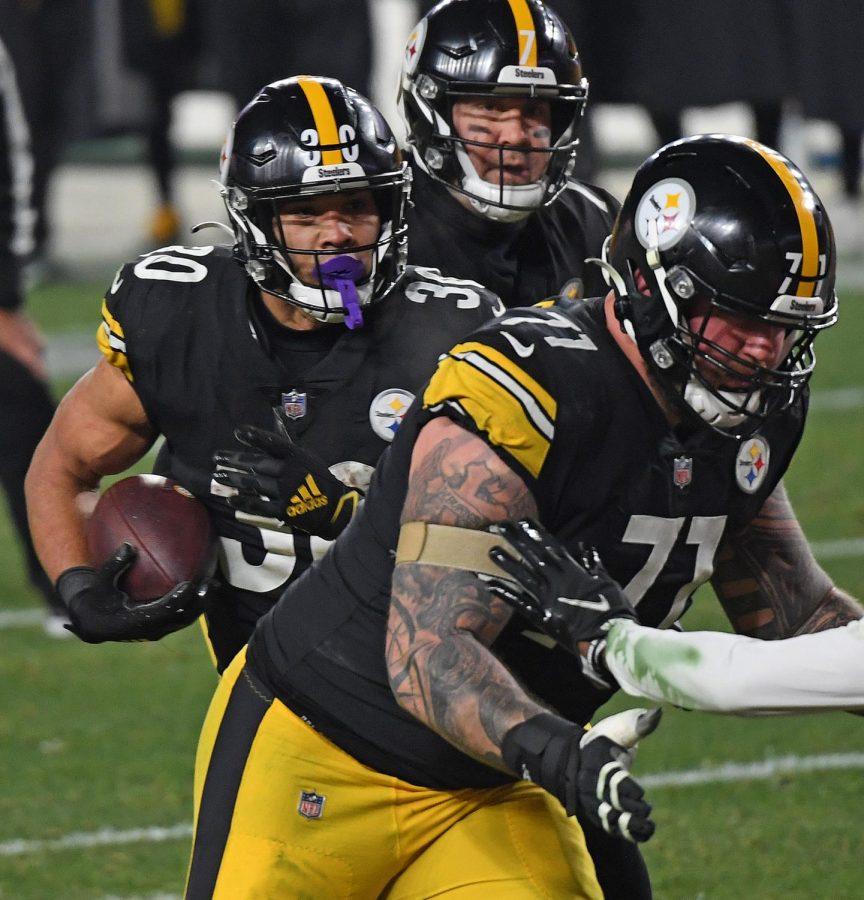 Pittsburgh+Steelers+running+back+James+Conner+scores+in+the+first+half+against+the+Cleveland+Browns+during+the+NFL+wild+card+playoff+game+on+Sunday%2C+Jan.+10%2C+2021%2C+at+Heinz+Field+in+Pittsburgh%2C+Pennsylvania.