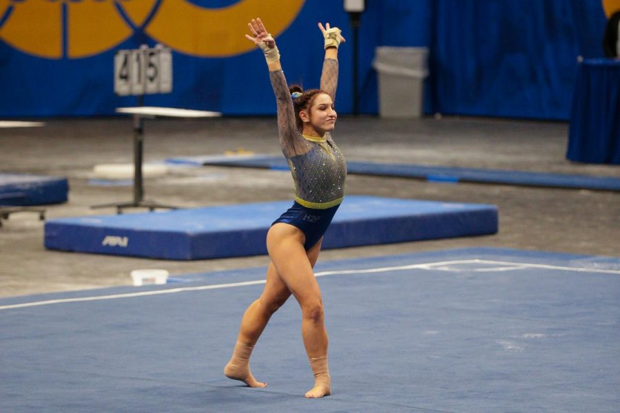 Senior+gymnast+Jordan+Ceccarini+tied+for+first+in+floor+exercise+with+a+score+of+9.90.