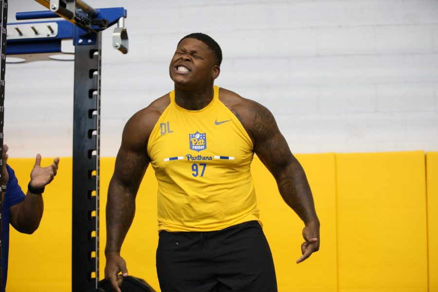 Defensive lineman Jaylen Twyman reacts after his bench press performance, pumping out 40 reps of 225 pounds on Wednesday.