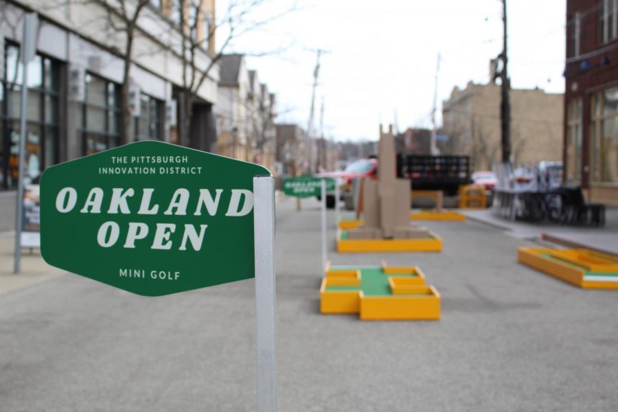 The Oakland Open, a mini golf course installed by the Pittsburgh Innovation District on Oakland Avenue, is intended to generate business for local eateries and restaurants. 