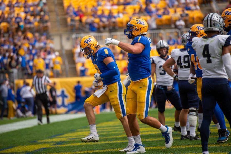 Quarterback Kenny Pickett and tight end Lucus Krull celebrate during Saturdays Homecoming game against the New Hampshire Wildcats at Heinz Field.