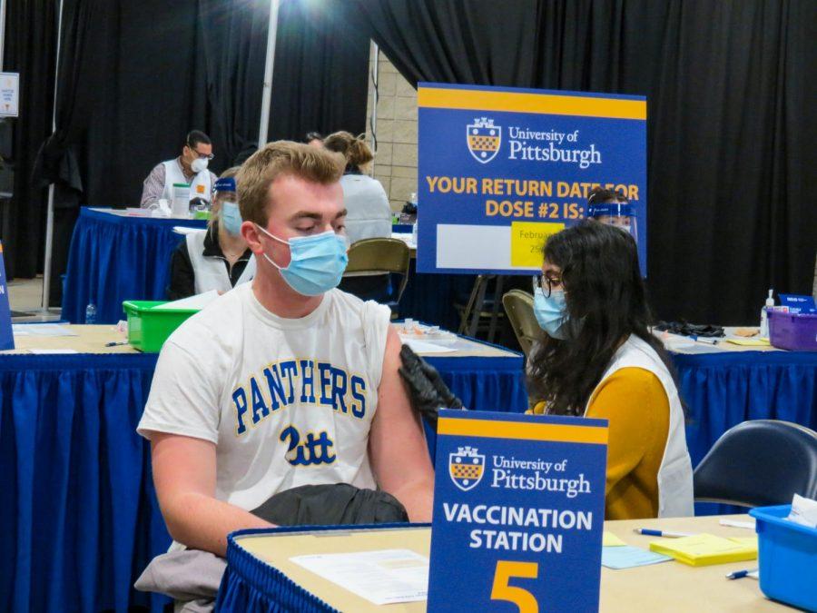 Students, pictured, at a late January vaccination clinic hosted by Pitt and the Allegheny County Health Department. More than 400 faculty members sent an open letter over the summer to Chancellor Patrick Gallagher in support of a COVID-19 vaccine mandate for the safety of the University community.