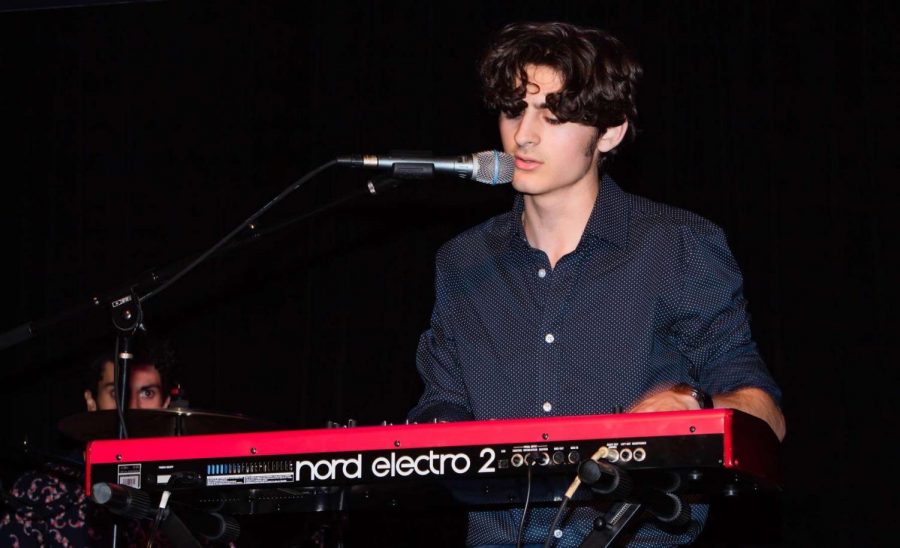 Patrick Swain, first-year economics major, plays keyboard at The Cave in Buffalo, New York, in June 2019.