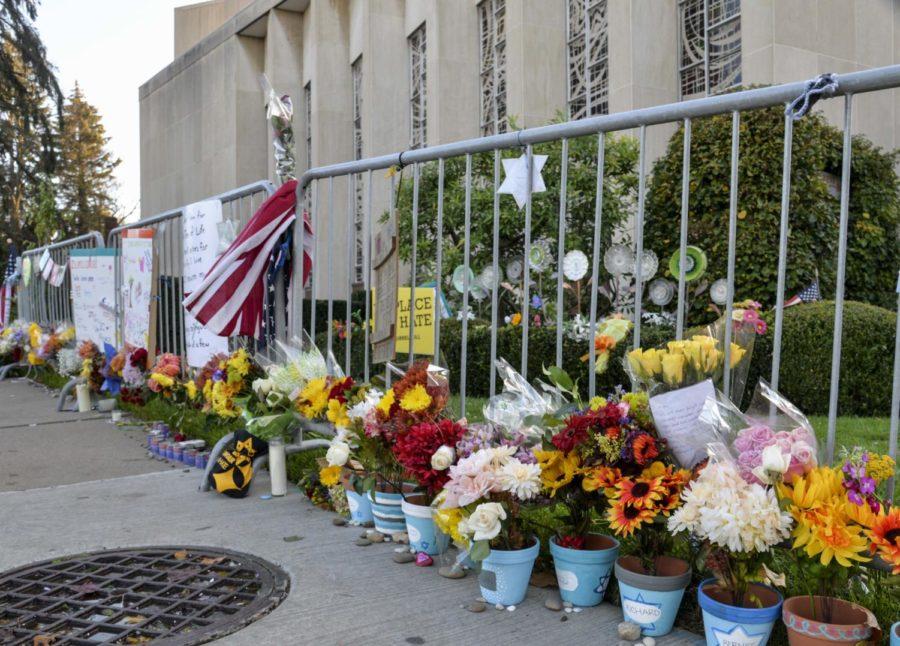 Flowers, candles and chalk drawings placed outside the Tree of Life Synagogue in 2019.