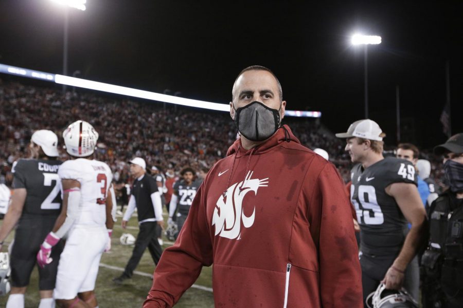 Former Washington State University head coach Nick Rolovich walks on the field after a football game against Stanford University on Oct. 16. WSU recently fired Rolovich for not following the state’s vaccine mandate for public employees.  