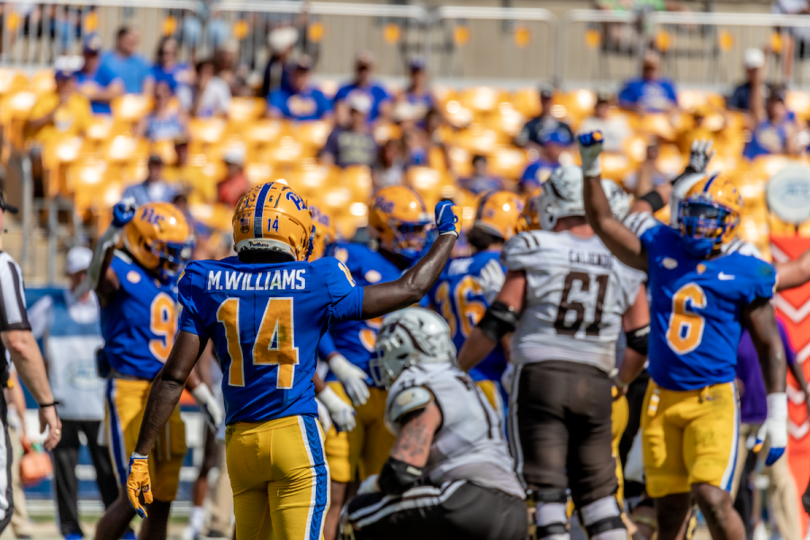 Marquis Williams (14) celebrates with other Panthers during the Pitt vs. WMU football game in September.