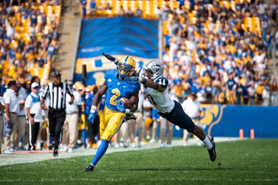 A+UNH+football+player+attempts+to+tackle+sophomore+running+back+Israel+Abanikanda+during+the+Pitt+vs.+UNH+game+in+September.