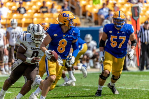 Kenny Pickett eludes the defensive rush at the Pitt vs. Western Michigan game.
