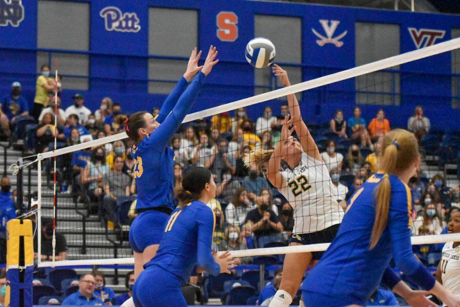 Graduate student Kayla Lund (23) prepares to bump the ball back over the net at Pitt’s volleyball game against Georgia Tech at the Fitzgerald Field House on Sunday. 
