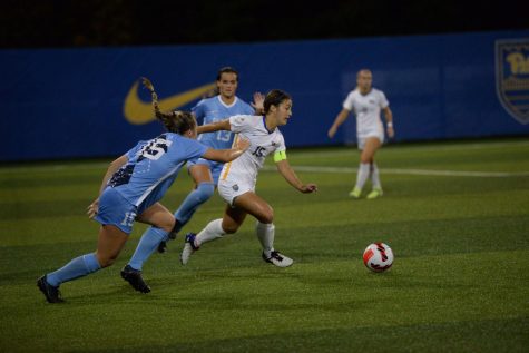 Midfielder Chloe Minas (15) runs to the ball at Ambrose Urbanic Field on Thursday night against UNC. The Panthers lost 1-0. 