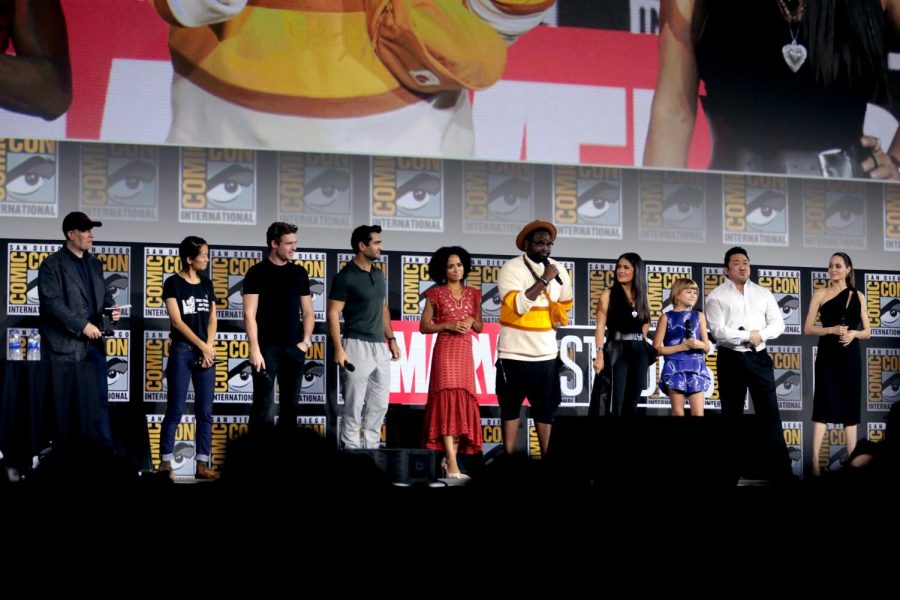 The cast of “The Eternals” — from left, Kevin Feige, Chloé Zhao, Richard Madden, Kumail Nanjiani, Lauren Ridloff, Brian Tyree Henry, Salma Hayek, Lia McHugh, Don Lee and Angelina Jolie — speak at the 2019 San Diego Comic Con International at the San Diego Convention Center. 