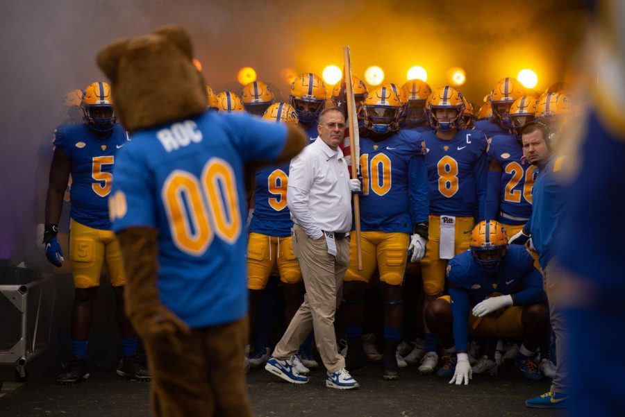 The Pitt Panthers prepare to enter the field with head coach Pat Narduzzi.
