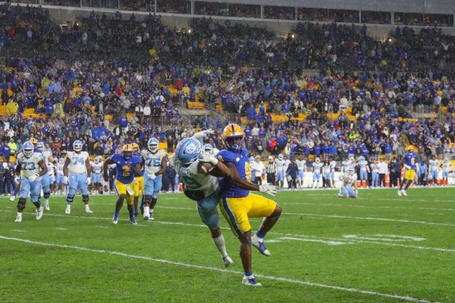 UNC+defensive+back+Cam%E2%80%99Ron+Kelly+%289%29+and+Pitt+redshirt+sophomore+defensive+lineman+Calijah+Kancey+%288%29+collide+during+Thursday%E2%80%99s+football+game+vs.+UNC.