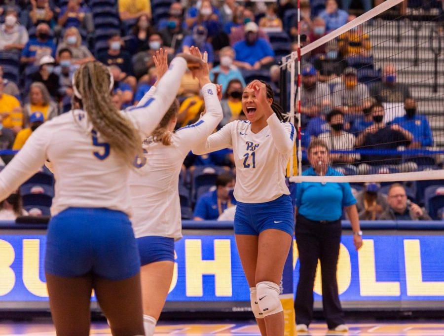 From left, Pitt rightside hitter and middle blocker fifth year Chinaza Ndee (5), setter graduate student Kylee Levers (6) and middle blocker senior Serena Gray (21) cheer each other on during the Sept. 29 game against the University of Virginia at the Fitzgerald Field House.
