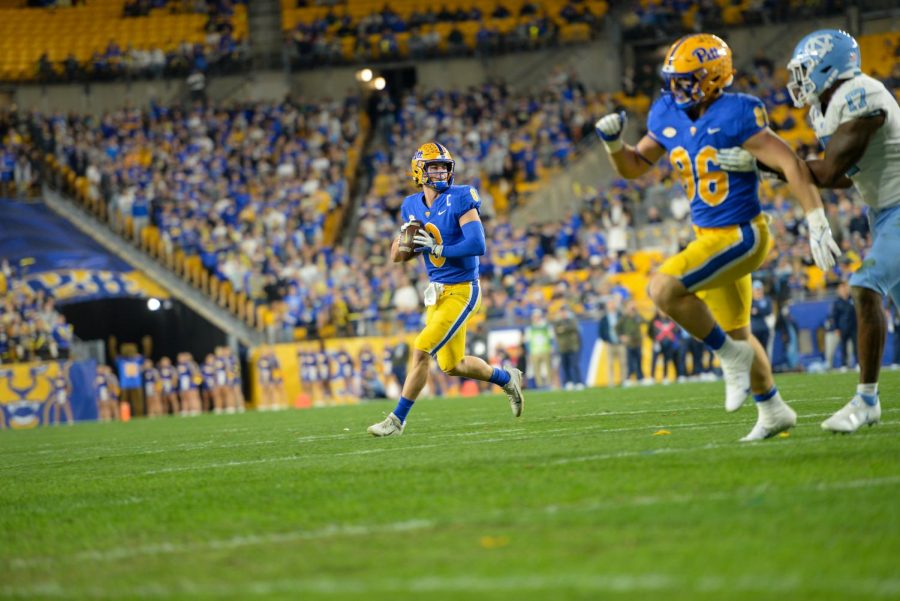 Pitt quarterback Kenny Pickett (8) prepares to throw the ball at Thursday evening’s game against UNC. 
