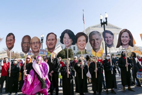 Abortion rights advocates hold cardboard cutouts of the Supreme Court justices faces in front of the U.S. Supreme Court in Washington, D.C. on Wednesday. 
