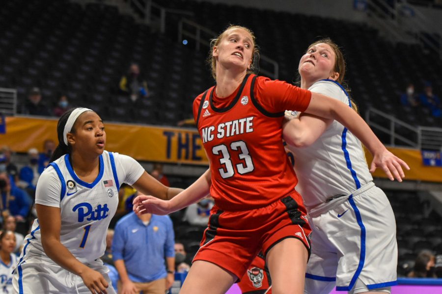 NC State women's basketball player Elissa Cunane (33) blocks Pitt player Mary Dunn (15) from catching a rebound during the Pitt vs. NC State game on Friday night. 