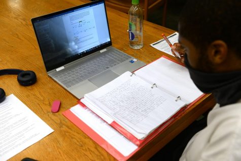 Montez Newsome, a junior mathematics-economics major, studies for an organic chemistry project at Hillman Library on Friday evening. 

