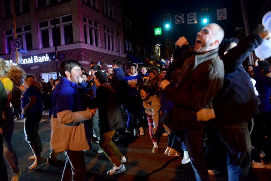 Pitt students celebrate Pitt's Saturday night ACC Championship win against Wake Forest University at the intersection of Forbes and Oakland avenues.
