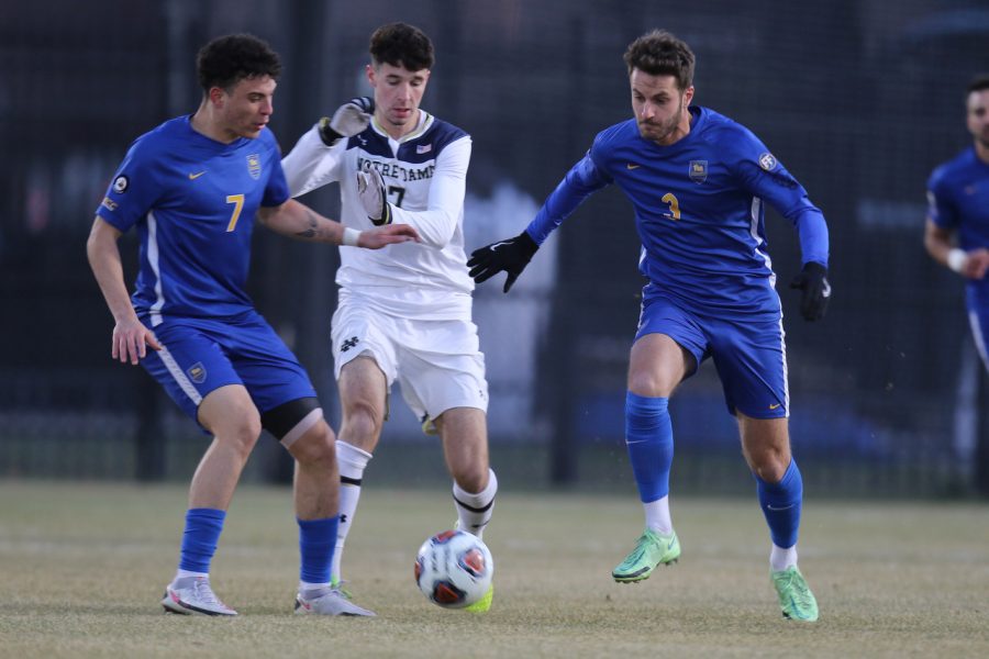 Pitt first-year midfielder Guilherme Feitosa (7) and junior defender Raphaël Crivello (3) battle with Notre Dame junior midfielder Ethan O’Brien (7) for possession of the ball during Saturday evening’s game against the University of Notre Dame at Alumni Stadium in South Bend, Indiana.
