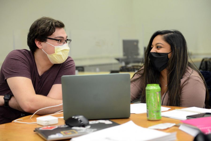 Jason Buffer, left, and Shalini Jose, graduate students in the School of Medicine’s biomedical masters program, study for their biochemistry final in Hillman Library on Friday evening.