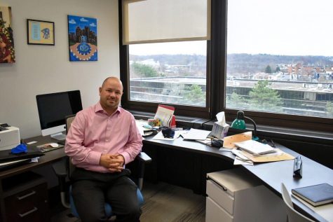 Chris Bonneau, political science professor, in his office in Posvar Hall on Wednesday. 
