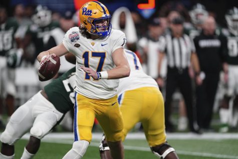 Pittsburgh quarterback Davis Beville (17) looks to pass against Michigan State during the first half of the Peach Bowl NCAA college football game, Thursday, Dec. 30, 2021, in Atlanta.