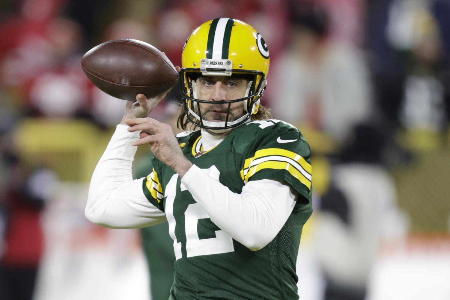 Green Bay Packers' Aaron Rodgers warms up before last Saturday’s game ...