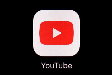 The YouTube app is shown on an iPad.