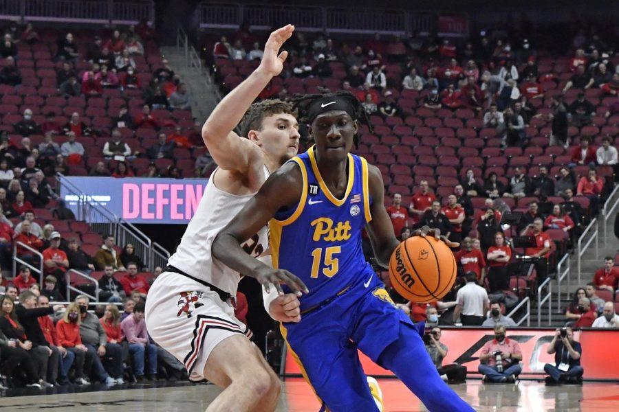 Pittsburgh+forward+Mouhamadou+Gueye+%2815%29+drives+around+Louisville+forward+Matt+Cross+%2833%29+during+the+first+half+of+an+NCAA+college+basketball+game+in+Louisville%2C+Ky.%2C+Wednesday%2C+Jan.+5%2C+2022.