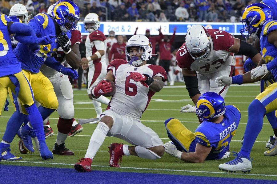 Arizona Cardinals running back James Conner (6) runs for a touchdown during the second half of an NFL playoff football game against the Los Angeles Rams in Inglewood, California, Monday, Jan. 17.