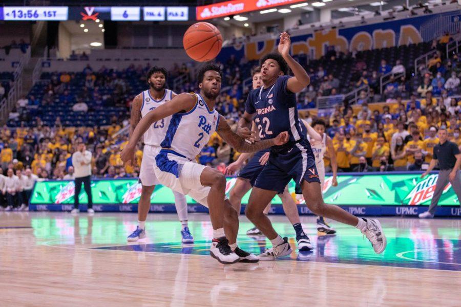 Pitt+sophomore+guard+Femi+Odukale+%282%29+and+Virginia+sophomore+guard+Reece+Beekman+%282%29+chase+the+ball+at+Wednesday%E2%80%99s+game+at+the+Petersen+Events+Center.+