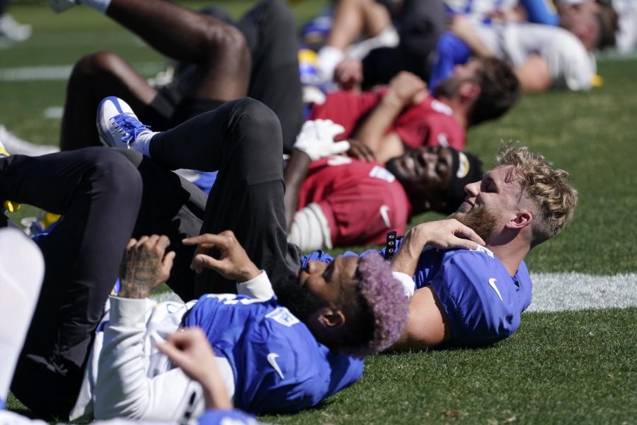 Los Angeles Rams wide receiver Cooper Kupp, right and wide receiver Odell Beckham Jr., left, stretch during practice on Thursday in Pasadena, California, for Sunday’s Super Bowl game. 