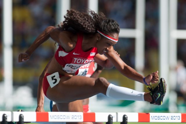 American track and field olympian Brianna Rollins-McNeal jumps over a hurdle in the 2013 World Championships in Athletics, held in Moscow.
