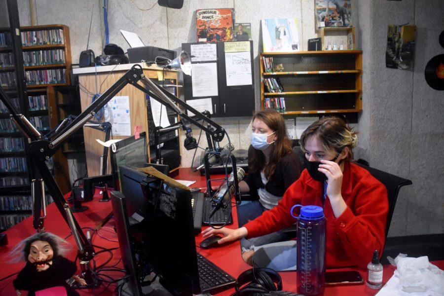 Olivia Ivatts, junior sociology major and assistant station manager, left, and Elizabeth Sidelnikov, junior engineering major and student engineer, at WPTS Radio during the 24-hour winter marathon from Friday to Saturday.
