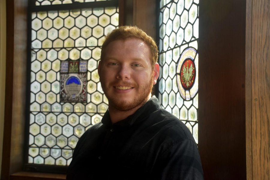 Zach Hartman, a computer engineering and classics major, nationality room tour guide and the Quo Vadis president in the Cathedral of Learning’s Polish nationality room on Monday. 
