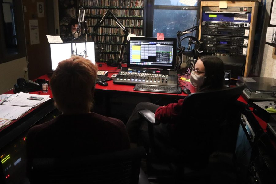 Zachary Fields, left, and Edie Fields, co-hosts of South x South Oakland, sit in the WPTS radio station.