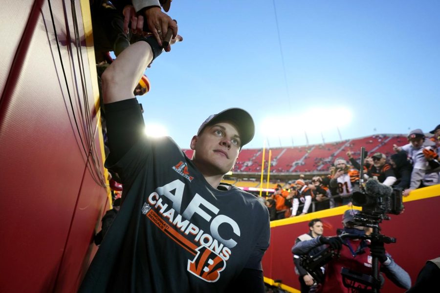 Cincinnati Bengals quarterback Joe Burrow celebrates with fans after the AFC championship NFL football game against the Kansas City Chiefs, Sunday, Jan. 30, 2022, in Kansas City, Missouri. The Bengals won 27-24 in overtime. 