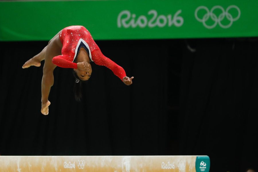 American+gymnast+Simone+Biles+competes+on+the+beam+in+the+2016+Rio+Olympics.