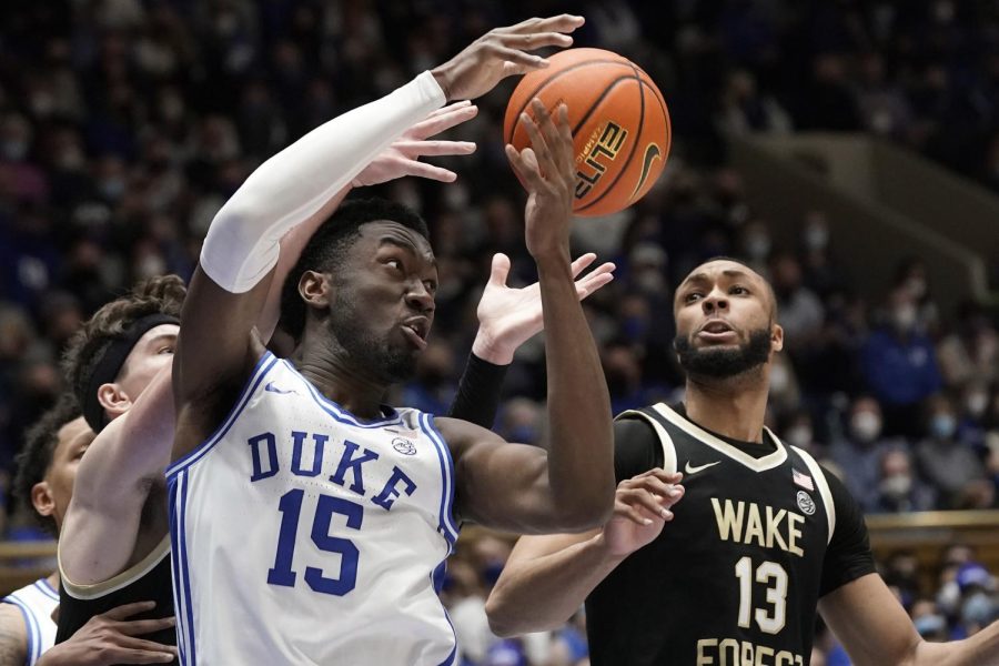 Duke sophomore center Mark Williams (15) struggles for the ball with Wake Forest graduate student forward Dallas Walton (13) during a game on Tuesday, Feb. 22, in Durham, North Carolina.