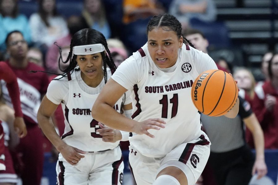 South Carolina senior guard Destiny Littleton (11), right, brings the ball up the court against Arkansas at the womens Southeastern Conference tournament on Friday, March 4, in Nashville, Tennessee. 