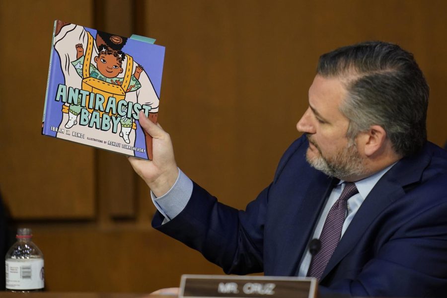 Republican Texas senator Ted Cruz holds up a book as he questions Supreme Court nominee Judge Ketanji Brown Jackson during her confirmation hearing before the Senate Judiciary Committee on Tuesday.  
