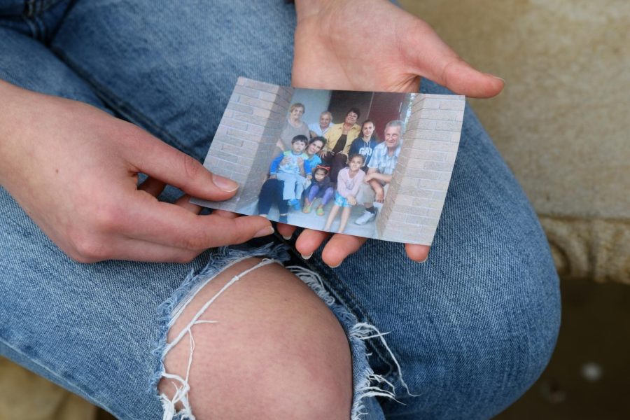 Anna Libikh holds a photo of her family who live in Ukraine. 
